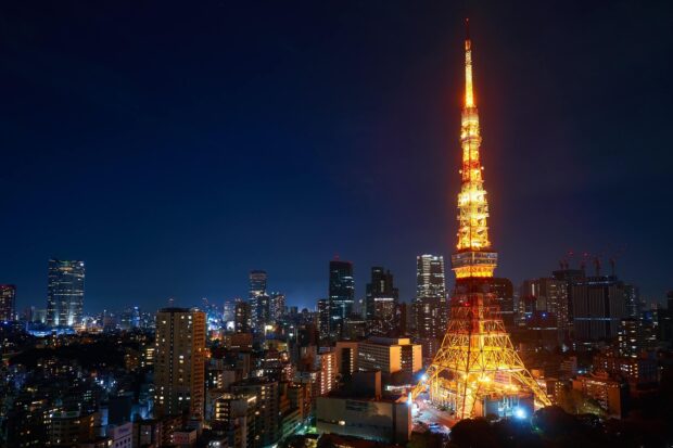 Tokyo Tower stands illuminated over Tokyo's skyline during the night, 2K Desktop Wallpaper