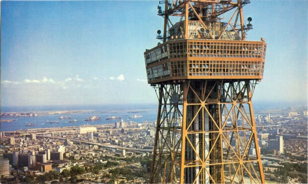 The Tokyo Tower close up shows the intricate structure with a cityscape in the background in Tokyo Tower Wallpapers, 2K Desktop Wallpaper