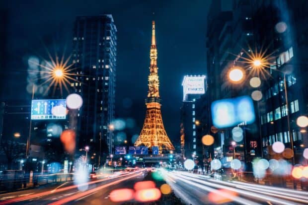 Tokyo Tower stands bright among city lights during night traffic, HD Desktop Wallpaper