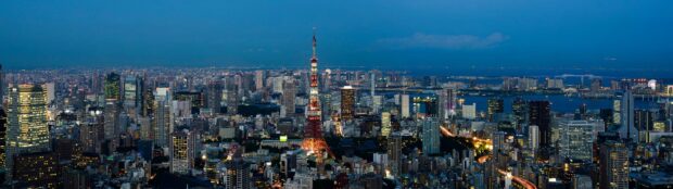 Tokyo Tower stands brightly at dusk in a panoramic city view, 4K Desktop Wallpaper