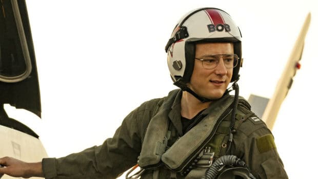 A pilot is preparing for flight in Top Gun Maverick, 2K Desktop Wallpaper