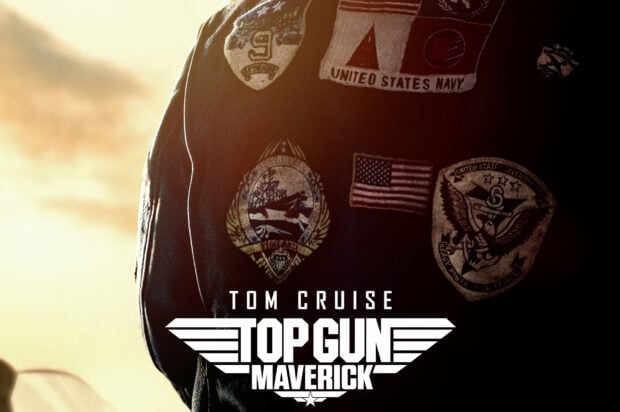 The Top Gun Maverick logo shows the movie title with a background of patches on a navy jacket, 2K Desktop Wallpaper