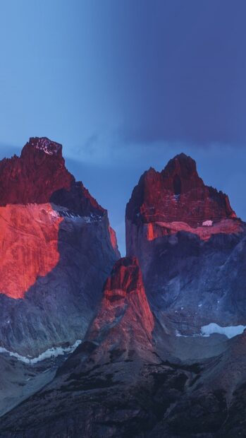 The rocky peaks of Torres Del Paine National Park glow red under the setting sun, HD Phone Wallpaper
