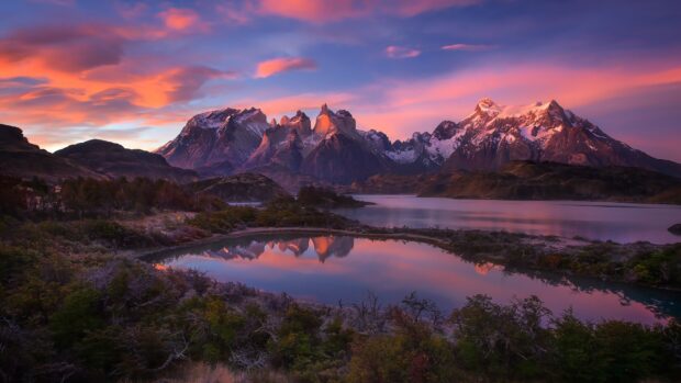 The Torres Del Paine National Park mountain range reflects in calm water during sunset, 4K PC Wallpaper