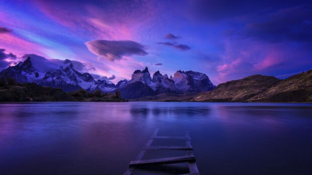 The purple sky reflects over the lake with Torres Del Paine National Park mountains in view, HD Desktop Wallpaper