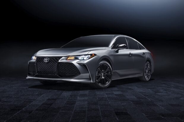 The Toyota Avalon displays a sleek and modern exterior design in a dark setting, HD Desktop Wallpaper