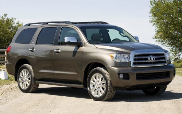 A Toyota Sequoia is parked on a gravel road with trees in the background, HD Desktop Wallpaper