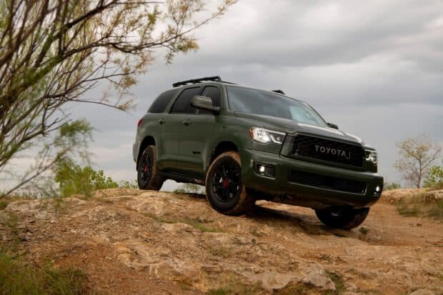 A Toyota Sequoia tackles rough rocky terrain under a cloudy sky, 2K Desktop Wallpaper