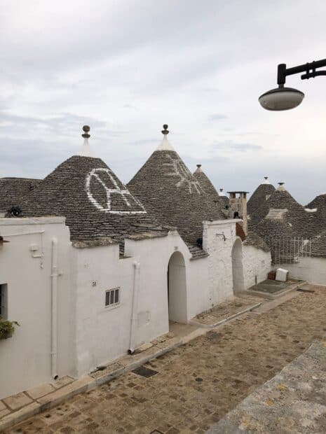 Alberobello features unique conical stone houses with distinct symbols painted on them, HD Desktop Wallpaper