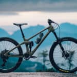 A Transition Bike is parked with mountains in the background during sunset, 2K Desktop Wallpaper