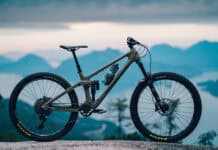 A Transition Bike is parked with mountains in the background during sunset, 2K Desktop Wallpaper