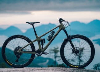 A Transition Bike is parked with mountains in the background during sunset, 2K Desktop Wallpaper
