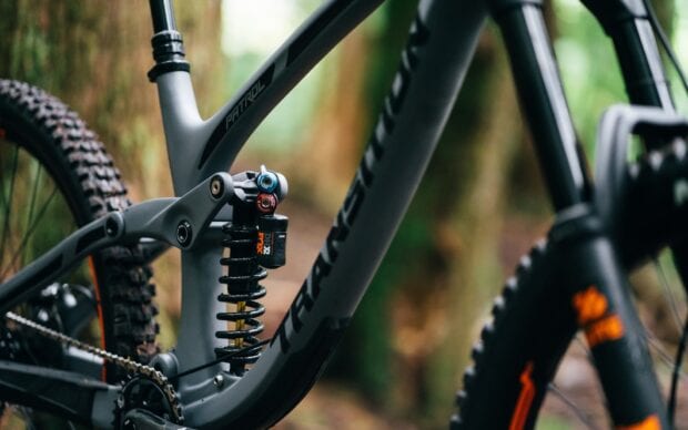 The image shows a Transition bike suspension system and detailed tire tread, HD Desktop Wallpaper