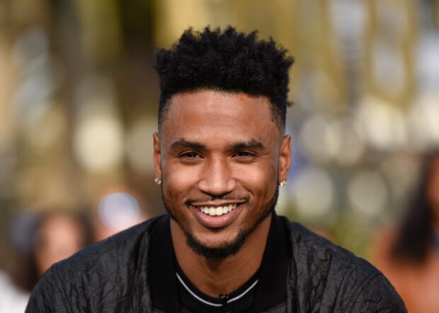 Trey Songz wallpapers showing a smiling man with short hair in a black jacket, 2K Desktop Wallpaper