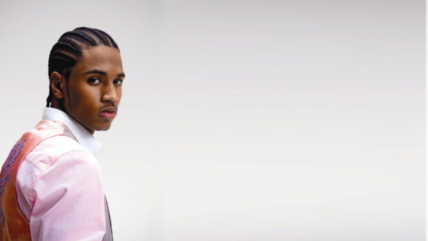 Trey Songz Wallpapers showing a man with braided hair looking back over his shoulder, HD Desktop Wallpaper