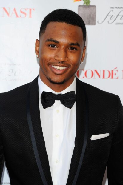 Trey Songz is wearing a black tuxedo with a bow tie at a formal event, HD Mobile Wallpaper