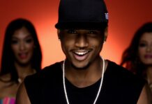 Trey Songz Wallpapers features a confident male artist smiling with two women behind him, HD Desktop Wallpaper