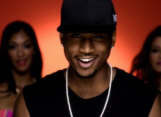 Trey Songz Wallpapers features a confident male artist smiling with two women behind him, HD Desktop Wallpaper