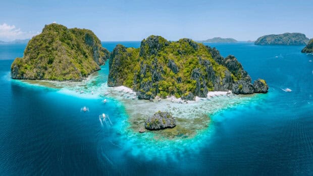 The crystal clear waters surround lush limestone cliffs in Palawan wallpapers, HD Desktop Wallpaper