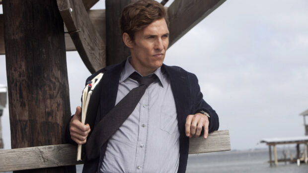 A man stands near a wooden pier holding files in a thoughtful pose for True Detective tv series, HD Desktop Wallpaper