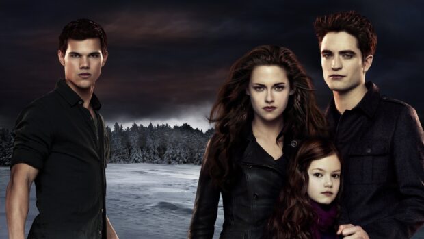 The main characters from Twilight movie stand in a snowy forest with a dark sky, HD Desktop Wallpaper