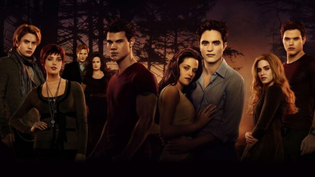 The Twilight movie characters pose together in a dark forest at dusk, HD Desktop Wallpaper