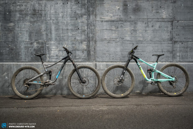Two dirty mountain bikes with Marin branding lean against a gray concrete wall on the street, HD Desktop Wallpaper
