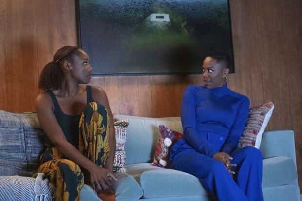 Two women are sitting on a couch having a conversation related to Insecure Tv Series wallpapers, HD Desktop Wallpaper