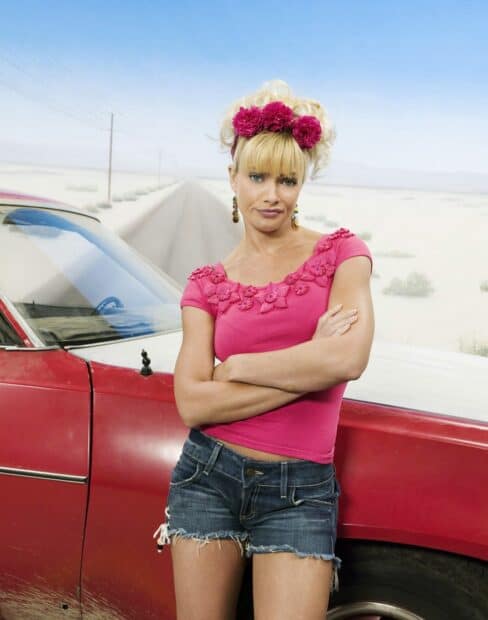 A woman stands with arms crossed near a red car in a desert setting from My Name Is Earl Tv Series Wallpapers, HD Desktop Wallpaper