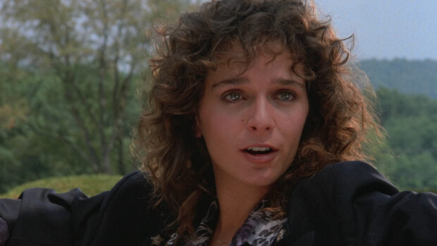 Valeria Golino is captured with curly hair in an outdoor setting, HD Desktop Wallpaper