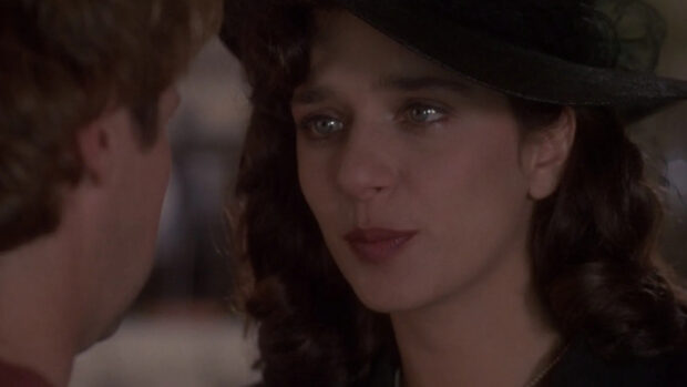 A close up portrait of Valeria Golino wearing a black hat in a dramatic scene, HD Desktop Wallpaper
