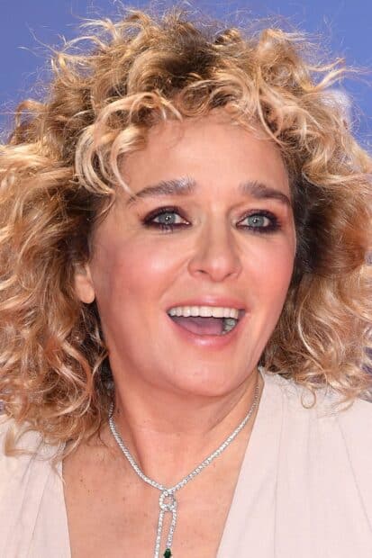 Valeria Golino smiles happily wearing a necklace, HD Phone Wallpaper