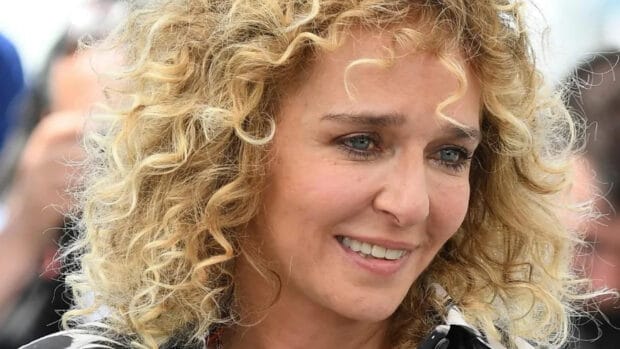 Valeria Golino is smiling with curly blonde hair in this portrait, HD Desktop Wallpaper