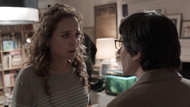 Valeria Golino has an emotional conversation with a man in a cozy room, HD Desktop Wallpaper