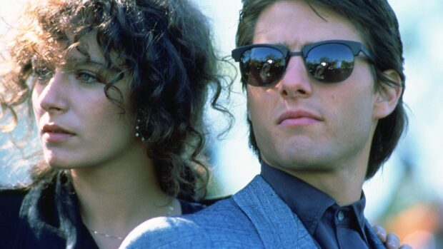 Valeria Golino standing next to a man wearing sunglasses and a suit looking away, 4K Desktop Wallpaper