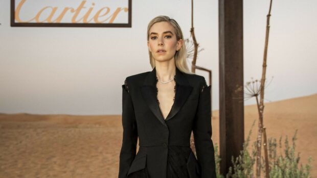 Vanessa Kirby Wallpapers stands confidently in a desert setting wearing a stylish black suit, HD Desktop Wallpaper