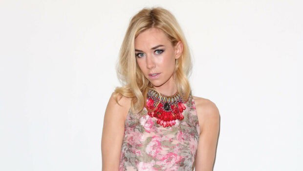 Vanessa Kirby is posing in a pink floral dress with a large red necklace against a white background, HD Desktop Wallpaper
