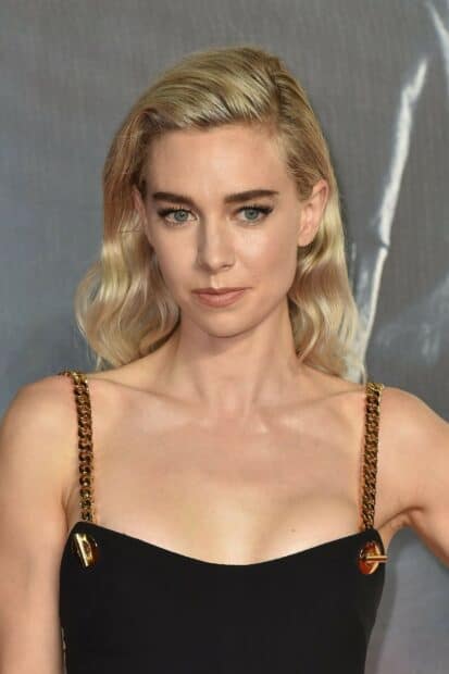 Vanessa Kirby wallpapers features her wearing a stylish black dress with gold chain straps, HD Phone Wallpaper