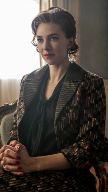 Vanessa Kirby wallpapers sitting with hands clasped wearing a textured jacket, 2K Mobile Wallpaper