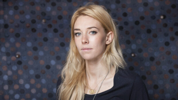 Vanessa Kirby wallpapers featuring a close up of her face against a dark circular pattern backdrop, HD Desktop Wallpaper