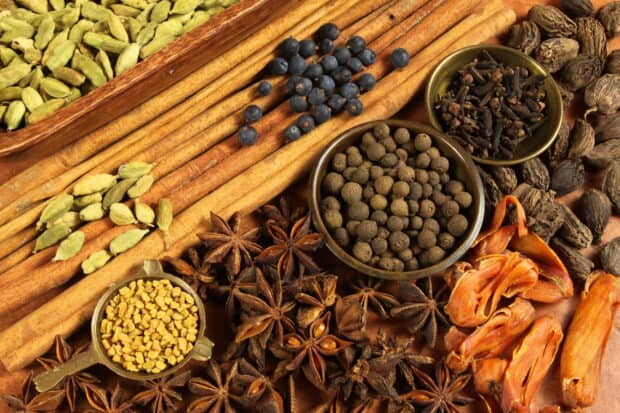A close up of seasoning spices including cinnamon, star anise, and cardamom, HD Desktop Wallpaper