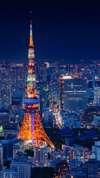 The Tokyo Tower stands illuminated against the city skyline at night, Tokyo Tower Wallpapers, 4K Phone Wallpaper