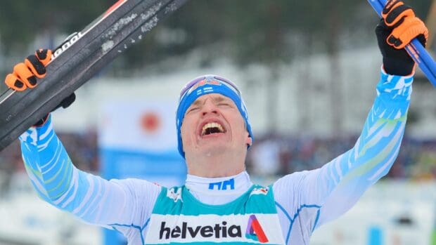 Iivo Niskanen celebrates his win with arms raised during a skiing competition, 2K Desktop Wallpaper