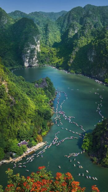 Vietnam Wallpapers showing a river with many boats among green mountains, HD Mobile Wallpaper