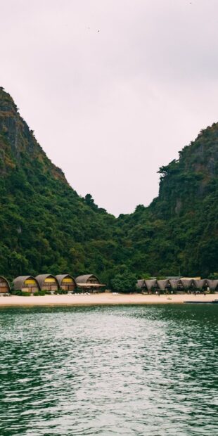 Vietnam Wallpapers showing cottages by the beach and green hills, HD Mobile Wallpaper