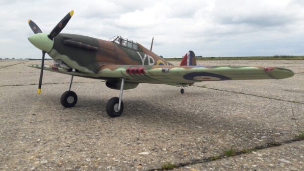 A Hawker Hurricane fighter plane is standing on a runway on a cloudy day, HD Desktop Wallpaper