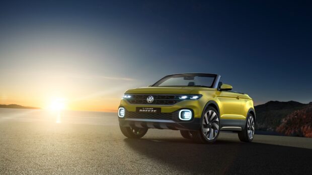 A yellow Volkswagen T Cross is parked with the sunset in the background, 4K Desktop Wallpaper