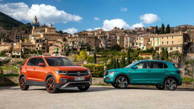 Two Volkswagen T Cross models parked with a scenic town backdrop, 4K Desktop Wallpaper
