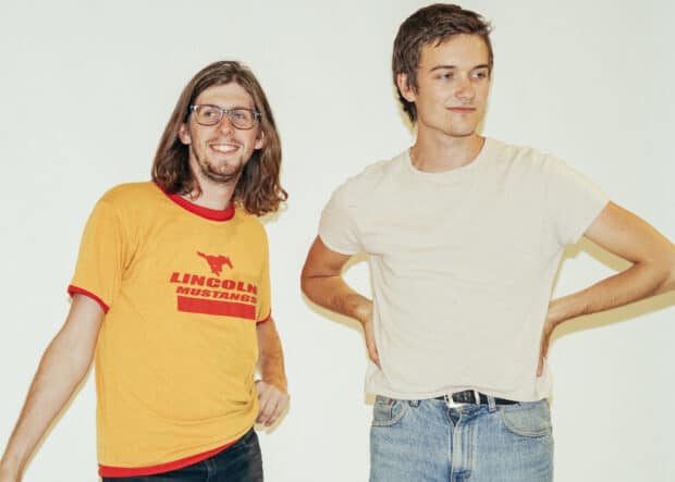 Two members of Vundabar band posing casually against a plain background, HD Desktop Wallpaper