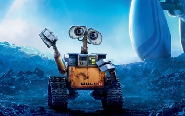 Wall E Pixar character stands on a rocky terrain near a spaceship, 2K Desktop Wallpaper